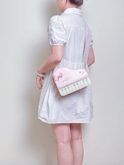 Chic Pink Crossbody Bag With Piano Key Design And Bow Accent