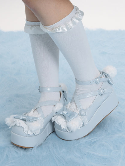 Blue Crisscross Design Plush Bunny Ear Decorated Bow at Top Platforms With Pompon