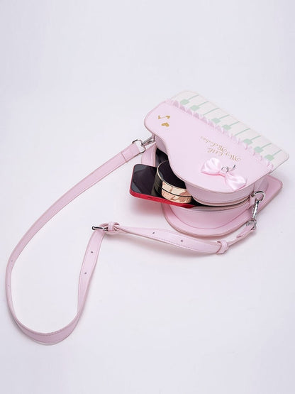 Chic Pink Crossbody Bag With Piano Key Design And Bow Accent
