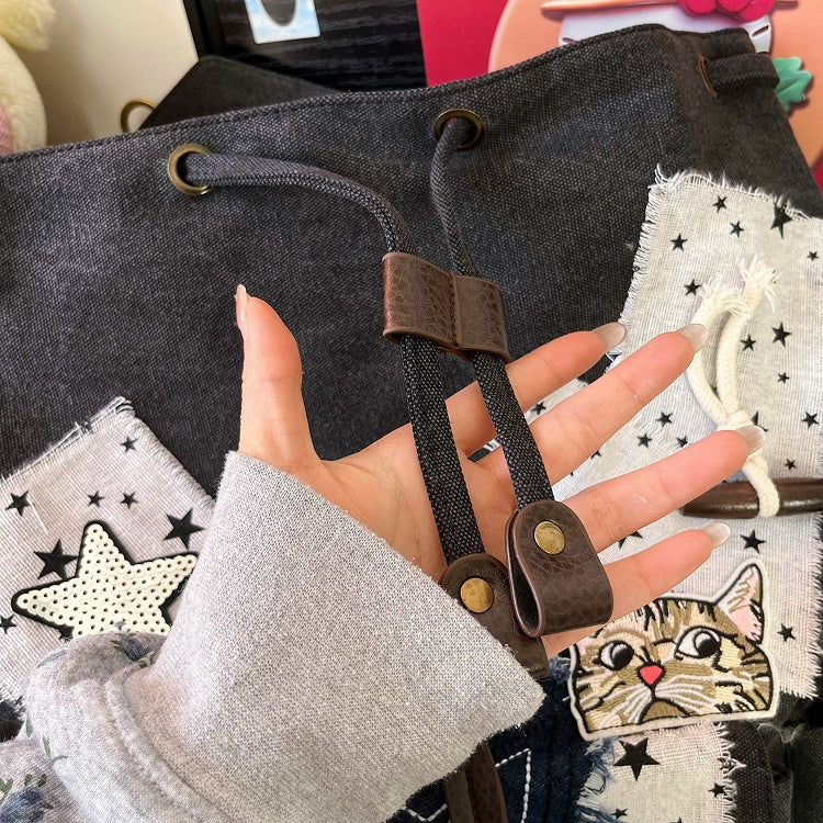 Black and white Washed Canvas Drawstring Backpack with Distressed Star Patches