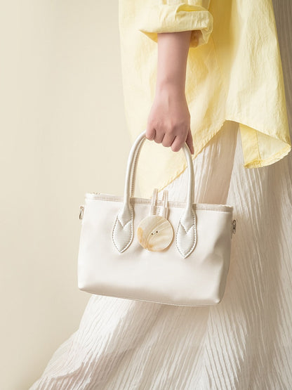 Vintage-Inspired Ivory Satin Handbag In Elegance