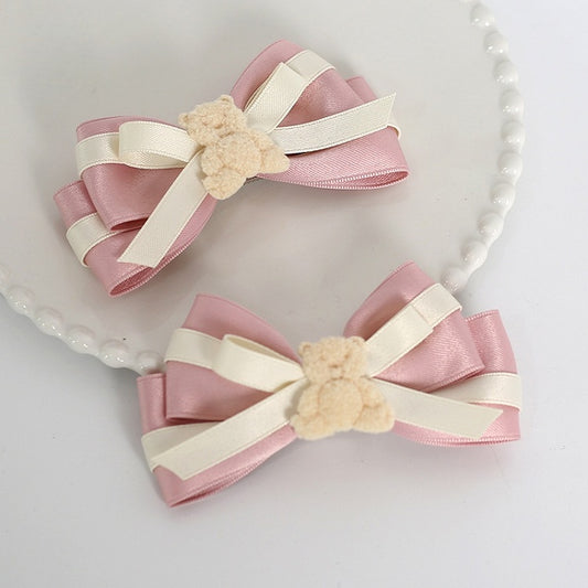 A Pair of Sweet Beige and Pink Bowknot Hairclips with Bear Decorations