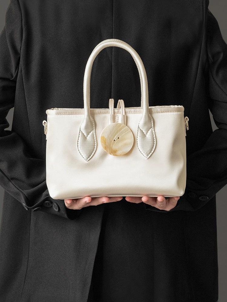 Vintage-Inspired Ivory Satin Handbag In Elegance