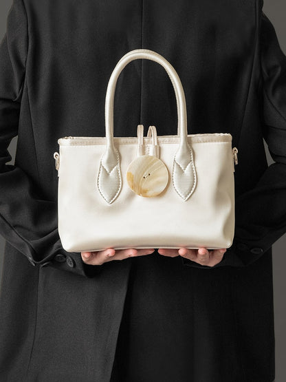 Vintage-Inspired Ivory Satin Handbag In Elegance