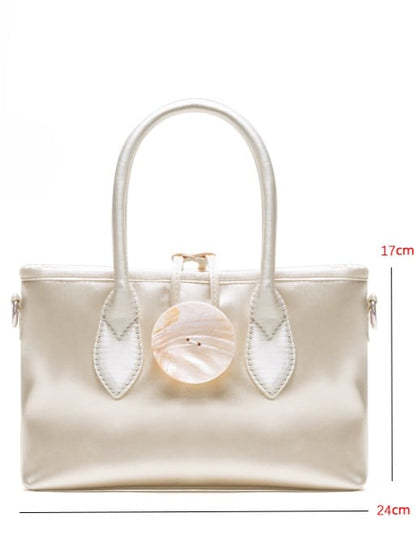 Vintage-Inspired Ivory Satin Handbag In Elegance