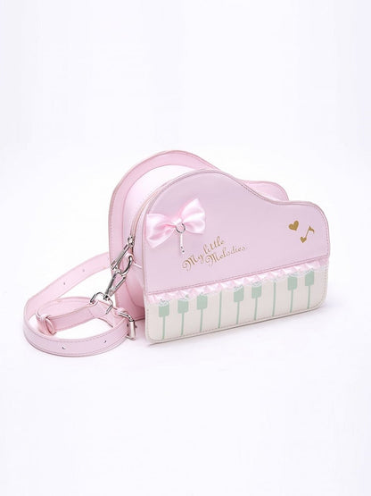 Chic Pink Crossbody Bag With Piano Key Design And Bow Accent