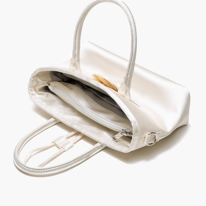 Vintage-Inspired Ivory Satin Handbag In Elegance