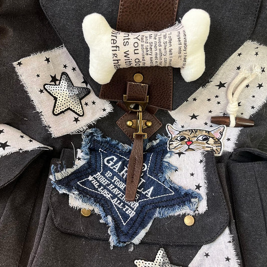 Black and white Washed Canvas Drawstring Backpack with Distressed Star Patches